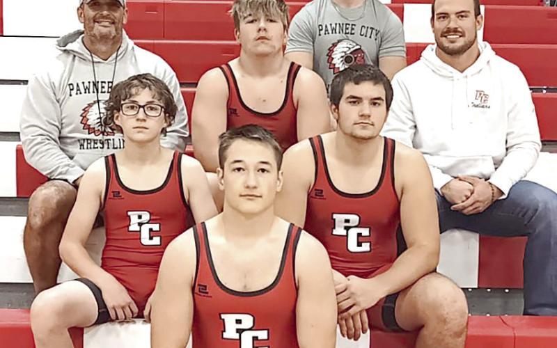 Members of the 2024-25 Pawnee City Wrestling Team are front: Jesse McLaughlin. Second row: Luke Hunzeker and Dylan Layne. Third row: Head Coach Shane Maloley, Gauge Schuetz, Coach Josh Andreasen. Back row: Coach Andy Maloley.