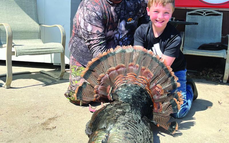 Mason Ellston and dad pose with the Fourth Place bird in the Youth Division