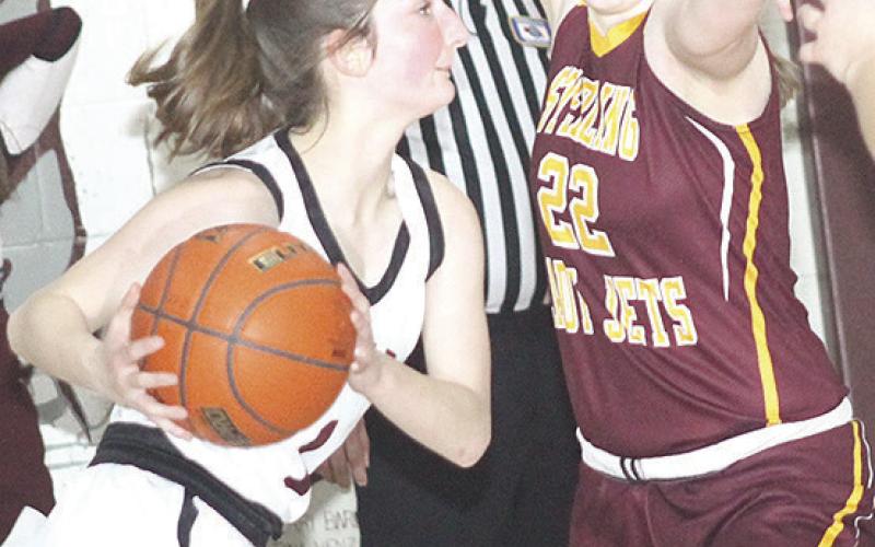 LHS’ Kierstin Rehrs (left) looks to pass to a teammate in Friday night’s game.