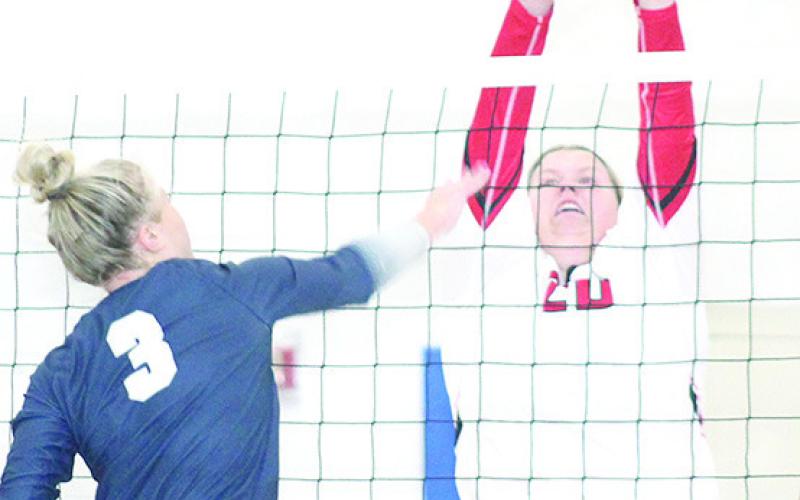 HTRS’ Macy Vrtiska (#3, left) powers a spike past a Wymore Southern defender last Thursday. Paula Jasa/Republican