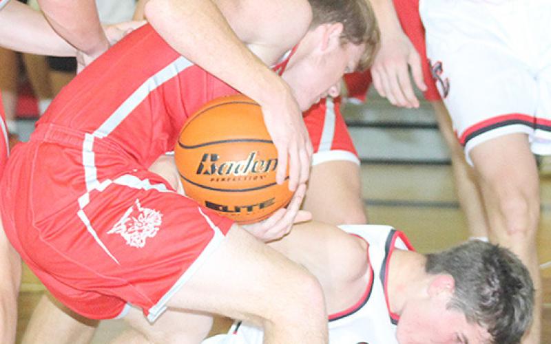 P.C.’s Drew Menninga (on floor) battles Frankfort for possession late in the game on Friday night. Paula Jasa/Republican