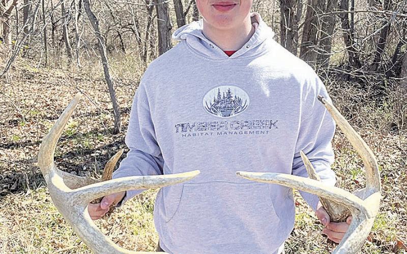 Grayson Gannaway with a matching set of sheds