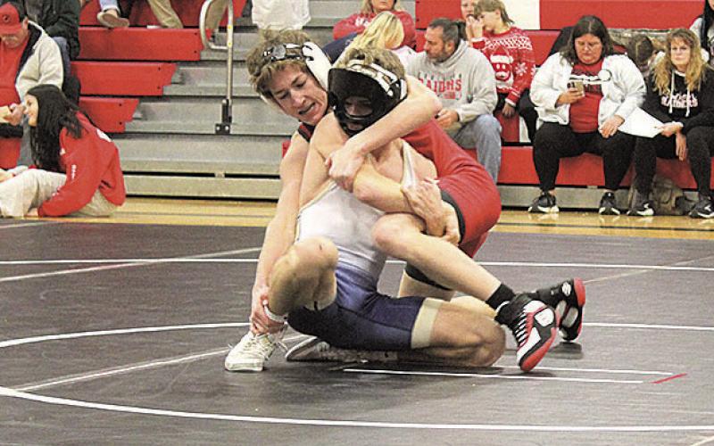 Pawnee City Indian Luke Hunzeker battles against Lincoln Lutheran Warrior Skylar Springer.