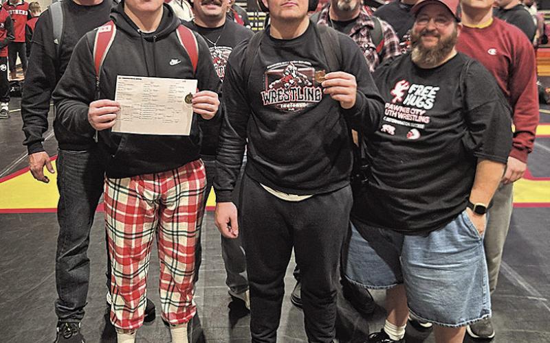 Pawnee City Wrestlers Take home hardware Back row from left: Head Coach Jacob Schuetz, Assistant Coach Kolton Taiclet, Coach Michael Layne, Team Assistant Jesse McLaughlin Front row: Champion Gauge Schuetz, 3rd place Dylan Layne, Coach Jake Otero