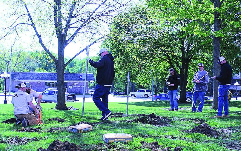 Volunteers Install New Flag Poles On Courthouse Lawn