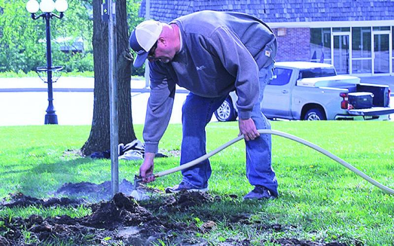 Volunteers Install New Flag Poles On Courthouse Lawn