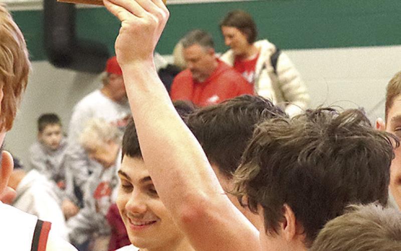 The Pawnee City Indians celebrate their 3rd place finish at the 2025 Pioneer Conference Tournament. Paula Jasa/Republican