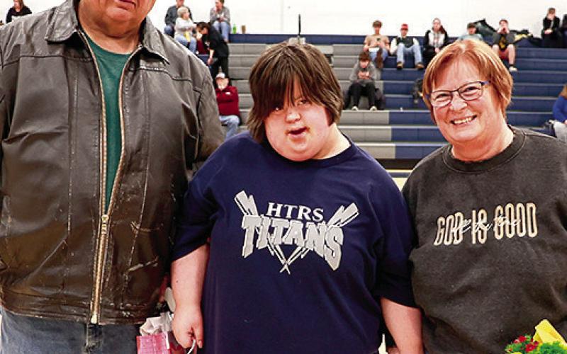 HTRS’ Kellee Snethen (center) pictured with her parents Russ and Roxie Snethen was honored on Parent’s Night for her participation in Unified Bowling this year. Photo courtesy of Lorrie Novak