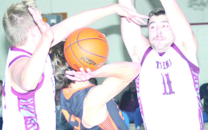 LHS’ Everett Bohling (left) makes a big block against a Diller/Odell player as teammate Brady Bledsaw (#11, right) goes up to do the same. Paula Jasa/Republican