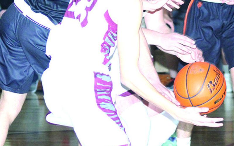 LHS’ Ashton Sanders (#23, center) fights for a loose ball against Diller/Odell. Paula Jasa/Republican