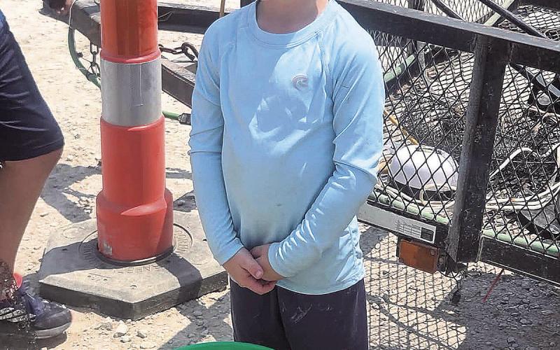 First Place winner for ages 2-9, Oliver Rauner and his winning bucket of fish.