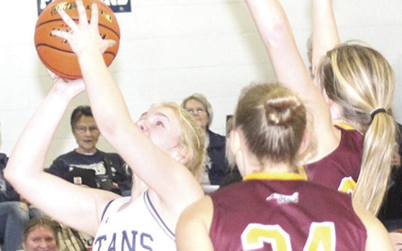 HTRS’ Elie Bstandig (#2, left) goes up for a rebound and putback against Sterling. Bstandig had 13 points and 12 rebounds for a double double against Sterling. Paula Jasa/Republican
