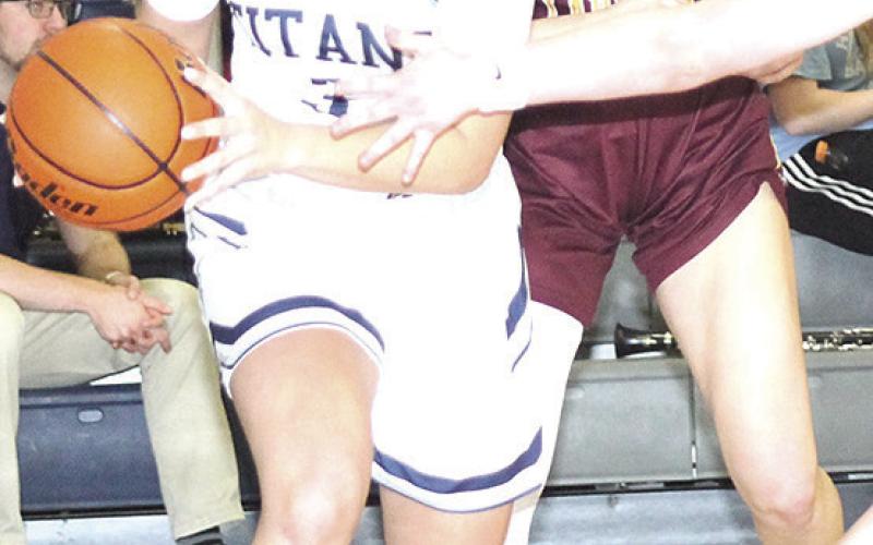HTRS’ Laramie Glathar (#3, left) drives the baseline against Sterling on Friday night. Paula Jasa/Republican