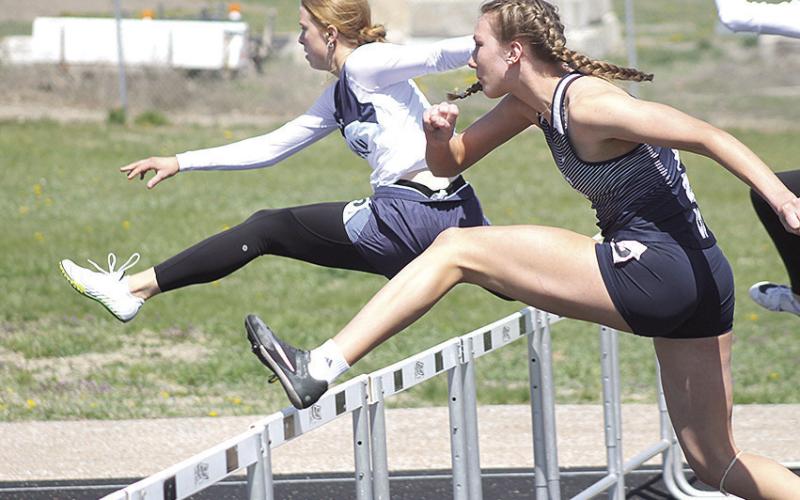 HTRS’ Makena Dunlap (right) clears her second hurdle in the girls’ 100 M. event on Tuesday at the Lewiston Invitational. Dunlap finished 4th with a time of 19.42. Paula Jasa/Republican