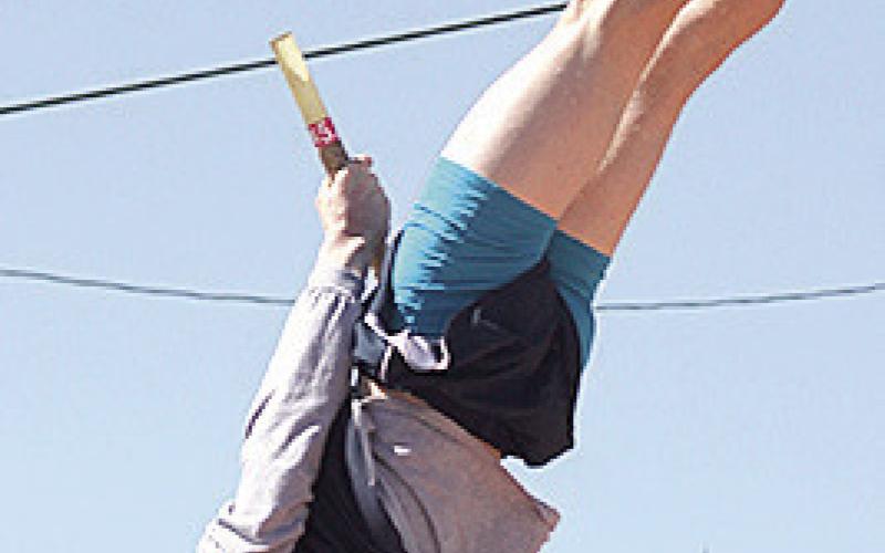 Paula Jasa/Republican HTRS’ Brogan Dunlap (left and above) bends the pole to clear 11’6” and claim the gold in the boys’ Pole Vault event last Tuesday at the Lewiston Invitational.
