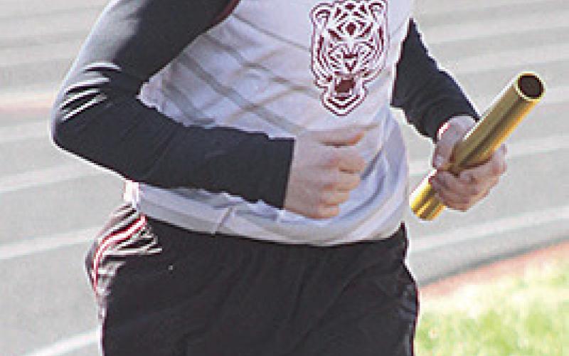 Paula Jasa/Republican LHS’ Evan Christen runs his leg of the boys’ 3200 M. relay.
