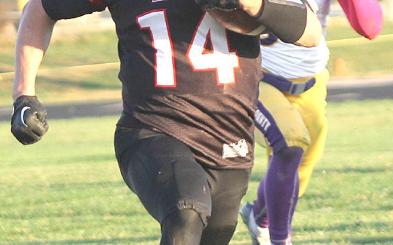 P.C.’s Jett Farwell (#14) gets out into the open field on this 33 yard touchdown run in the 2nd quarter. Paula Jasa/Republican