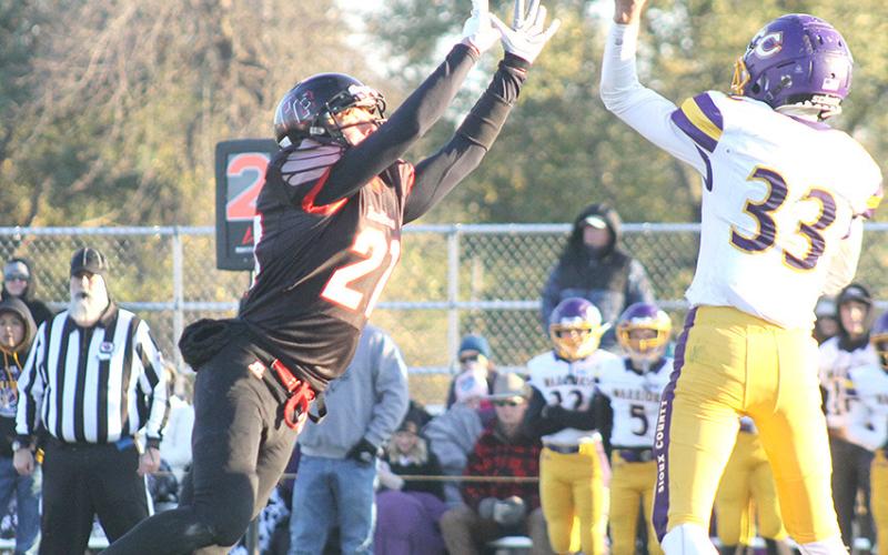 P.C.’s Trey Marteney (#21, left) was in the Warriors’ backfield numerous times during the game. After changing his torn jersey from #26 to #21, he recorded a total of 7 tackles, had 1 catch for 52 yards and had one fumble recovery. Paula Jasa/Republican