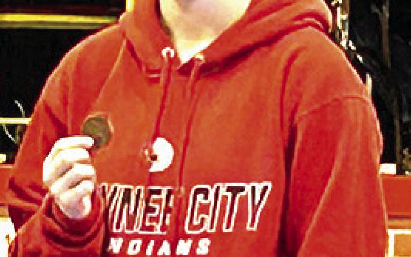 P.C.’s Kaylee Turnbull shows off her 3rd place medal at the Warcat Invitational last week. Photo courtesy of Jamie Maloley