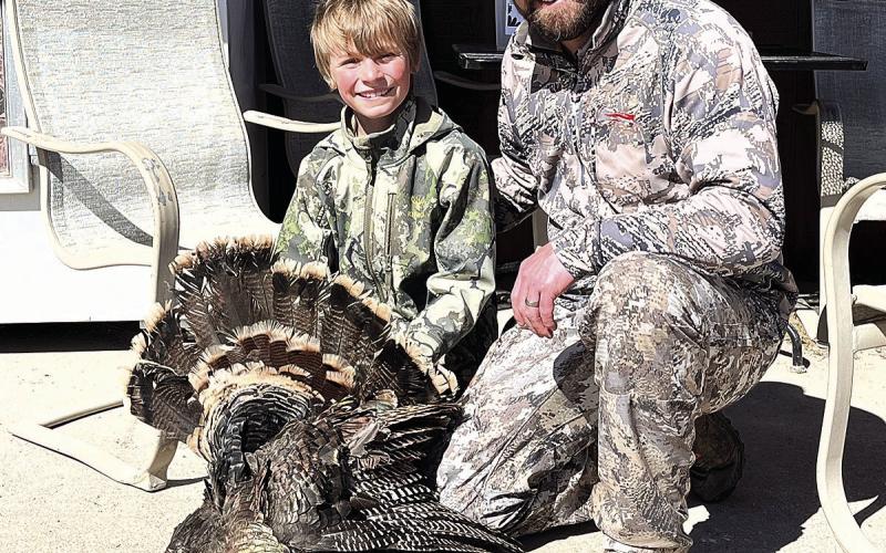Colton Sedivy (left) and his dad pose with the first bird of Colton’s two birds