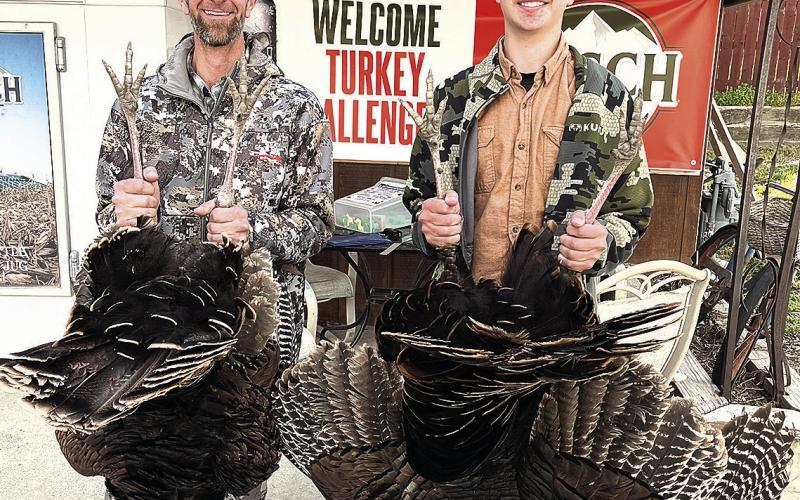 Everett Bender (left) and his son Zachary (right) are the leaders in the Adult Division