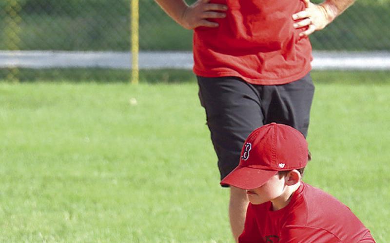 photos by Paula Jasa/Formerly of The Republican/and Trevor Jasa My next photo assignments are going to be of my grandchildren including Walker Jasa (above, inset) and Landon Jasa (above, right) forming their early athletic careers under the tutelage of my son Trevor (above, center). This will coincide with my future fishing endeavors (pictured below) on the family boat at Burchard Lake or on trips to Boston, the golf course, etc. with hubby, Bill!