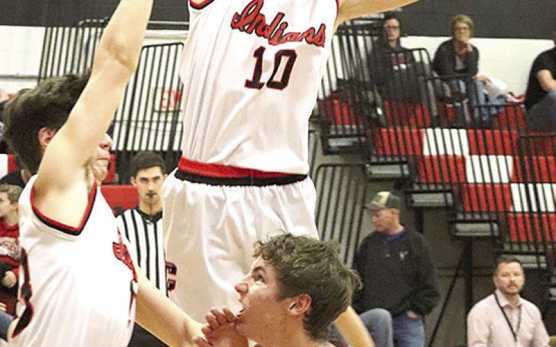 LHS’ Payton Heideman (#11, right) draws a crowd of Pawnee City defenders including Tyler Tegtmeier (left) and Drew Menninga (center, #10). Paula Jasa/Republican