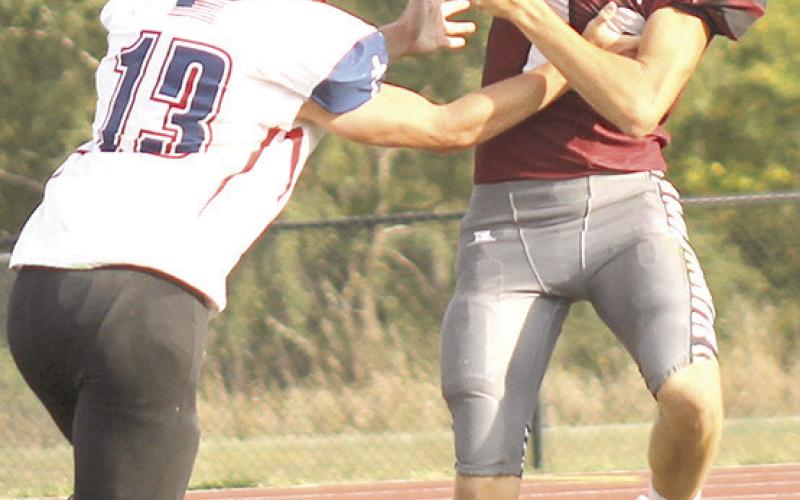 LHS’ Ashton Sanders (#12, right) goes up for a great grab against Parkview late in the game on Friday. Sanders had 3 catches for 58 yards in the victory over Parkview. Paula Jasa/Republican