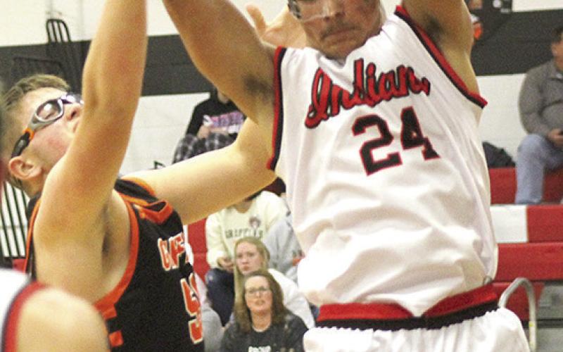 P.C.’s Atreyu Kling pulls in a strong rebound against the Griffins. Kling had 7 rebounds in the game. Paula Jasa/Republican