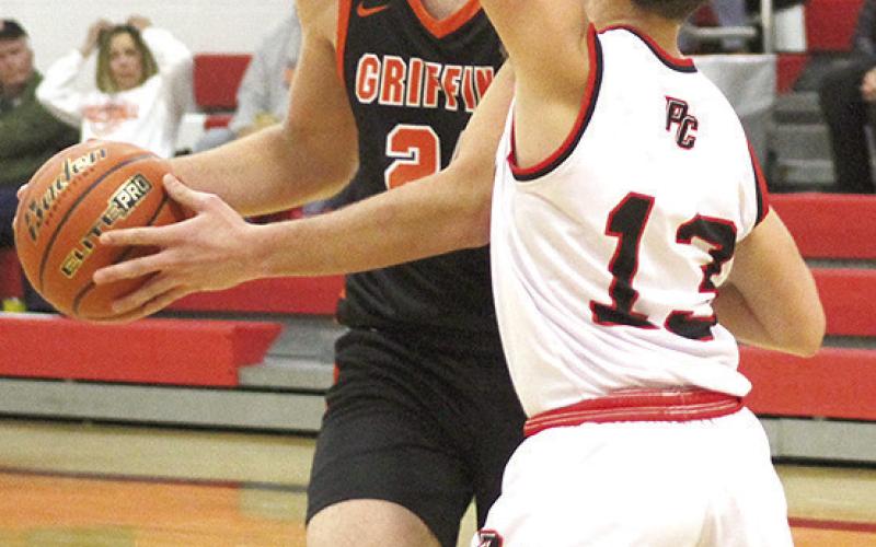P.C.’s Tyler Tegtmeier (#13, right) plays tough defense up top against the Griffins’ top scorer. Paula Jasa/Republican