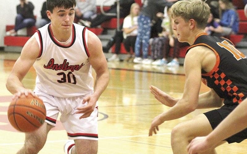 P.C.’s Jett Farwell (#30, left) looks to drive past Diller/Odell in Thursday night’s season opening win. Farwell scored 14 points in the P.C. triumph. Paula Jasa/Republican