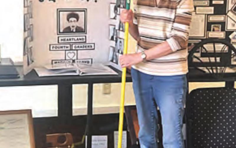 Marica Borcher cleaning at the Harold Lloyd Museum.
