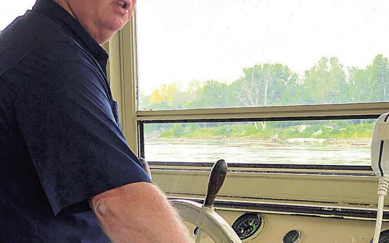At the wheel, Captain James Smith, pilot of the Spirit of Brownville for many years. His unexpected death in January of this year left the future of the boat hazy