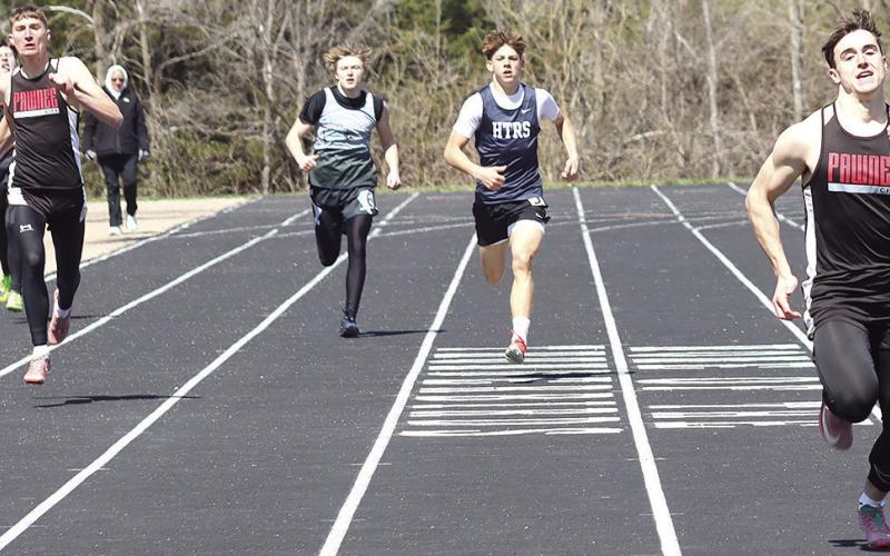 Pawnee City’s Jett Farwell (right) crosses the line first in the boys’ 400 M. Dash at 53.11 while teammate Drew Menninga (left) claims 2nd place at 55.62. HTRS’ Kameon Dettmann (center) placed 4th with a time of 55.90. Paula Jasa/Republican