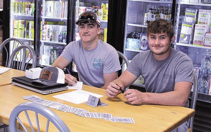 Jaydon Johnson (left) and Wyatt Blank (right) of J&amp;amp;B Lawn and Landscape were two of the business owners set up in The Little Brown Jug