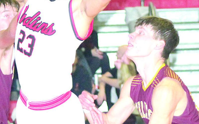 P.C.’s Anthony Kling (#23, center) gets pushed from behind on a layup attempt against Sterling. Paula Jasa/Republican