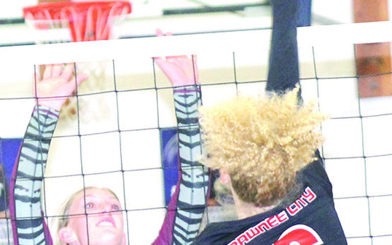 P.C.’s Madelyn Osborne (#6, right) goes up for a tip over LHS’ Maddie Janssen (#8, left) at the Pioneer. Paula Jasa/Republican