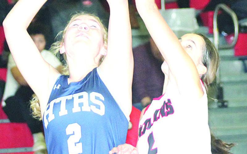 HTRS’ Elie Bstandig (#2, left) tries to score from underneath as P.C.’s Emalyse Gottula (#2, right) defends. Paula Jasa/Republican