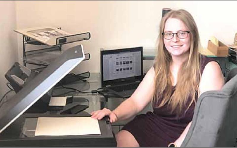 Lea Sobrilsky of Papillion spent the week scanning over 1,000 images into digital form. Sharla Sitzman Photo