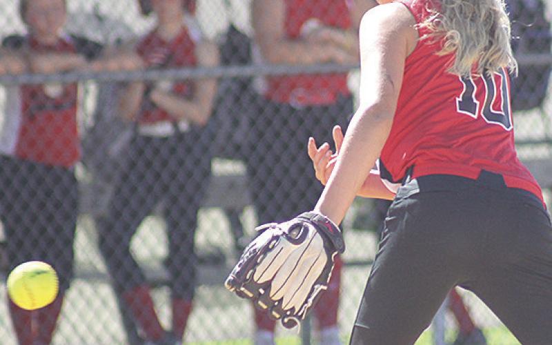 P.C.’s Kailyn Jensen (#10) delivers a pitch against Weeping Water on Sunday. Jensen collected 10 strike outs in the game which Pawnee City won 8-6. Paula Jasa/Republican