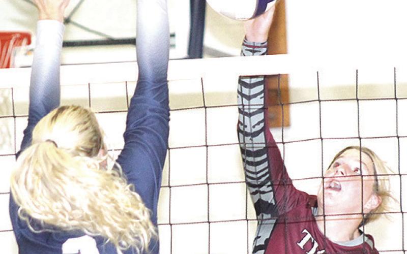 LHS’ DeLanye Currie (#7, right) goes up for a tip over HTRS’ Elie Bstandig (#2, left) last Tuesday night. Paula Jasa/Republican