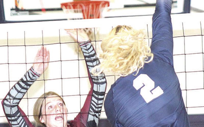 HTRS’ Elie Bstandig (#2, right) goes up high on the attack against LHS’ DeLanye Currie (#7, left). Paula Jasa/Republican