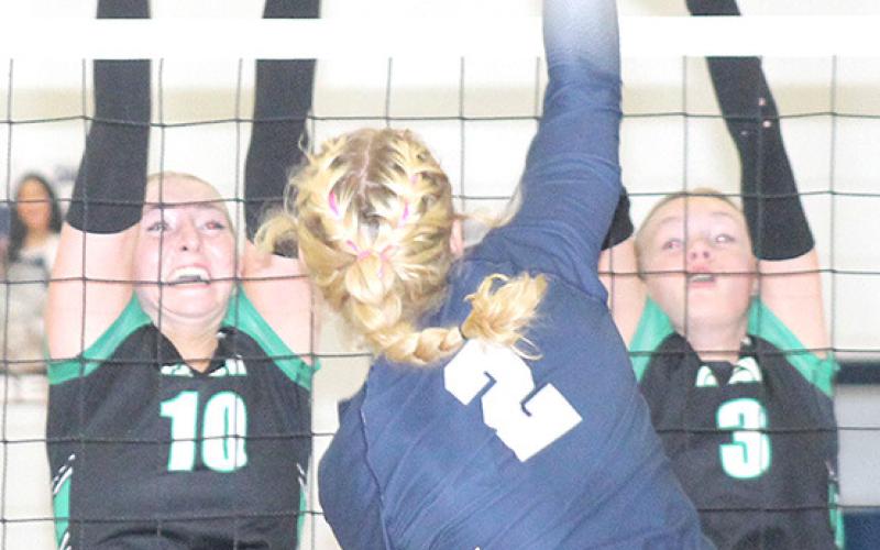 HTRS’ Elie Bstandig (#2, center) powers an attack off the hands of a FCSH blocker in Tuesday night’s game. Paula Jasa/Republican