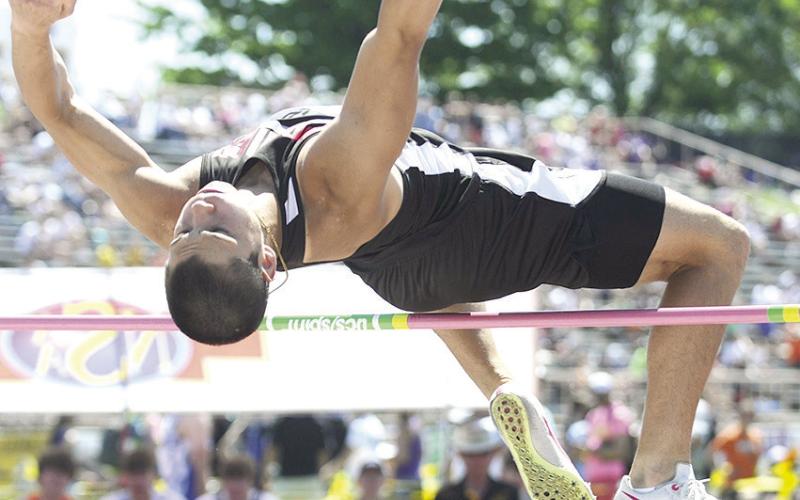 P.C.’s Anthony Kling clears the bar in the Class D boys’ High Jump event. Photo by Luke Nichols/Beatrice Daily Sun