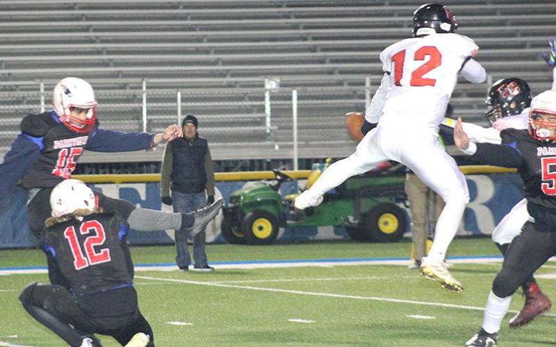 Pawnee City’s Andy Maloley (#12, center) blocks a PAT kick late in the game against Parkview Christian. Paula Jasa/Republican