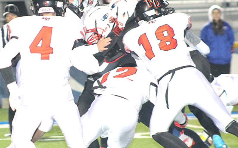 Pawnee City’s Jett Farwell (#4, left), Andy Maloley (#12, center) and Hunter Johnson (#18, right) get in on a tackle against Parkview on Friday night. Paula Jasa/Republican