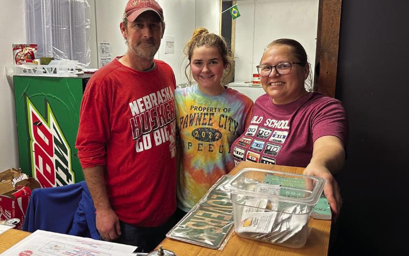 It’s a family affair! Arlan and Bobbie Meints take a break after the dinner rush at The Shop with their oldest daughter, Emma. All three of their daughters help with the restaurant and food truck when their school schedules allow.