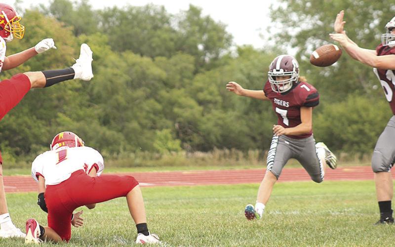 LHS’ Brody Wright (#61, right) blocks a Red Cloud PAT attempt early in the game as teammate Cashton Steinacher (#7, right) also rushes in. Wright blocked two PAT kicks in the game which LHS lost, 26-72. Paula Jasa/Republican