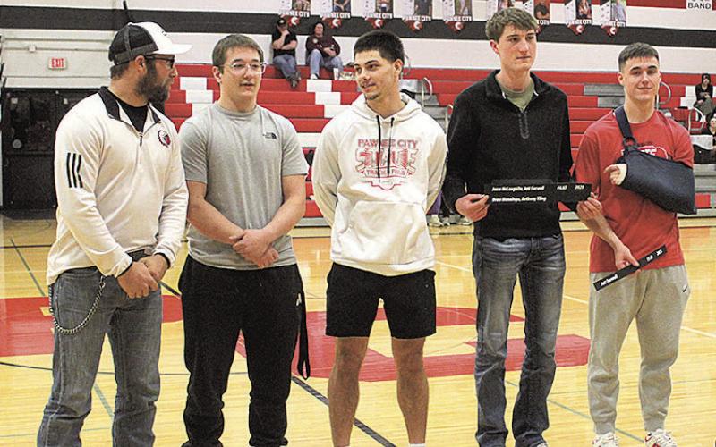 Last spring's 4x100 relay team was recognized for setting a new record time. The award was presented to the team by Ben Blecha, a member of the previous record holding team. Pictured above, from left: Ben Blecha, Jesse McLaughlin, Anthony Kling, Drew Menninga and Jett Farwell