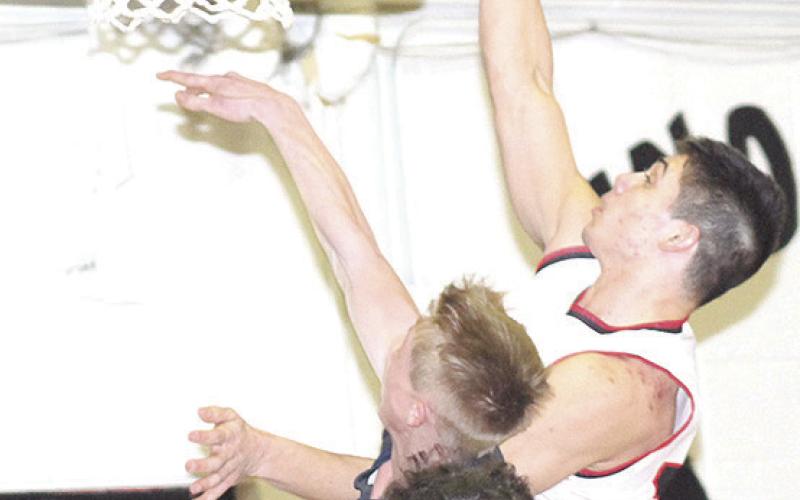 P.C.’s Anthony Kling scores two of his 24 points against HTRS on Tuesday night. Paula Jasa/Republican